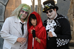 IN FOR A SCARE: Clockwise, Danelle Ferrari and her brothers stand outside the haunted house. PHOTO BY VALERIE SMITH