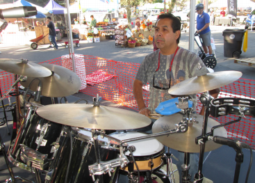 AT THE PUMPKIN FAIR: Robert Flores on the main stage getting  warmed up for the crowd early morning Saturday. PHOTO BY ORLANDO JOSE