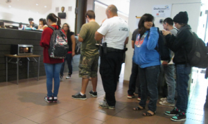 NOT ENOUGH MICROWAVES: As students warm up their food, a long line develops. PHOTO BY ORLANDO JOSE