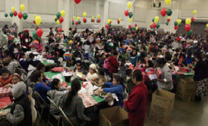 PRESENTING PRESENTS: Children enjoy themselves at the  Christmas presents distribution event at the San Joaquin County Fairgrounds. PHOTO COURTESY OF ANTOINETTE FOUTZ-CONTRERAS