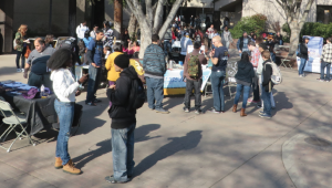 RUSHING FOR RECRUITS: Students check out campus clubs. PHOT BY BRIAN RATTO