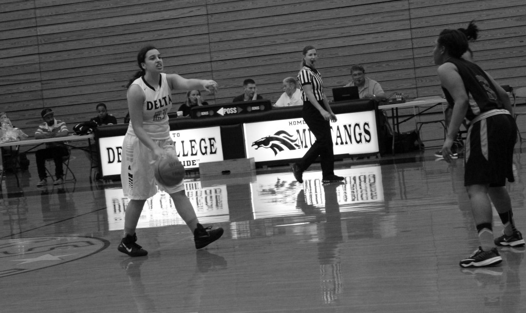 COURTSIDE: Guard Selina Moore running the floor, scoring 12 points during the home game on Feb. 17. PHOTO BY ZACHARIAH MERCES-SPINDLER