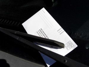 A parking ticket is found on the windshield of an illegally parked car in Cunningham 5 parking lot.