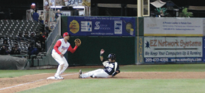 Infielder Nelson Muniz slides safely into third. PHOTO BY ZACARIAH MERCED-SPINDLER