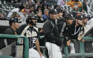 Delta Mustangs watch team- mates first at bats. PHOTO BY ZACAHARIAH MERCES-SPINDLER